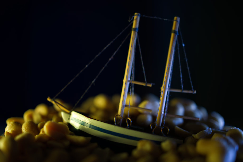 A ship on a "sea" of salty peanuts with storm like lighting